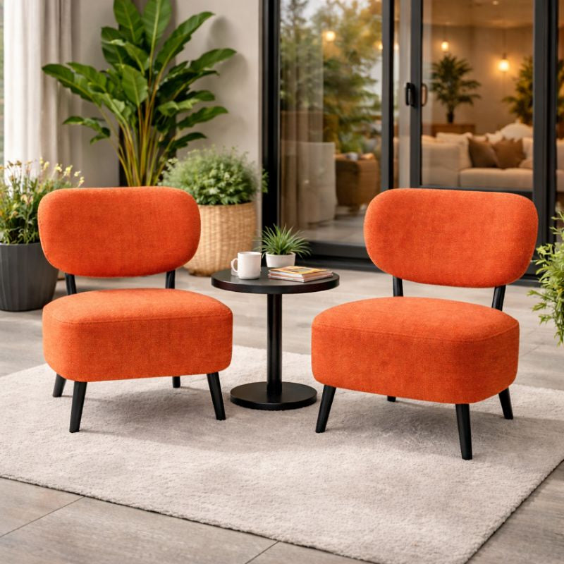 Pair of burnt orange upholstered accent chairs with black legs — Sona Casa