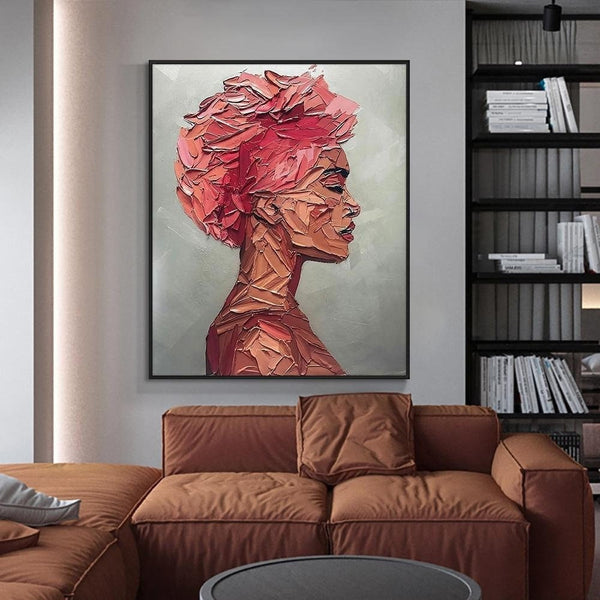 Textured woman portrait canvas painting above a brown sofa — Sona Casa