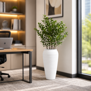 White Riser Planter – white textured riser planter with foliage in an office
