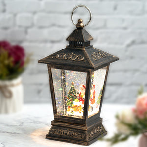 Christmas Snow Globe Lantern with Lights and Music, Santa with Christmas Tree, and Fake Snow - Great for Decoration and as a Gift by Sona Casa