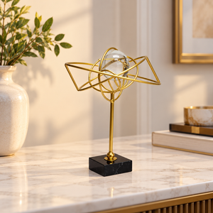 Gold Metal Orbit Sculpture with Crystal Ball – 10-Inch Décor