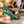 Decorative teal horse and gold-detailed chariot holding a wine bottle